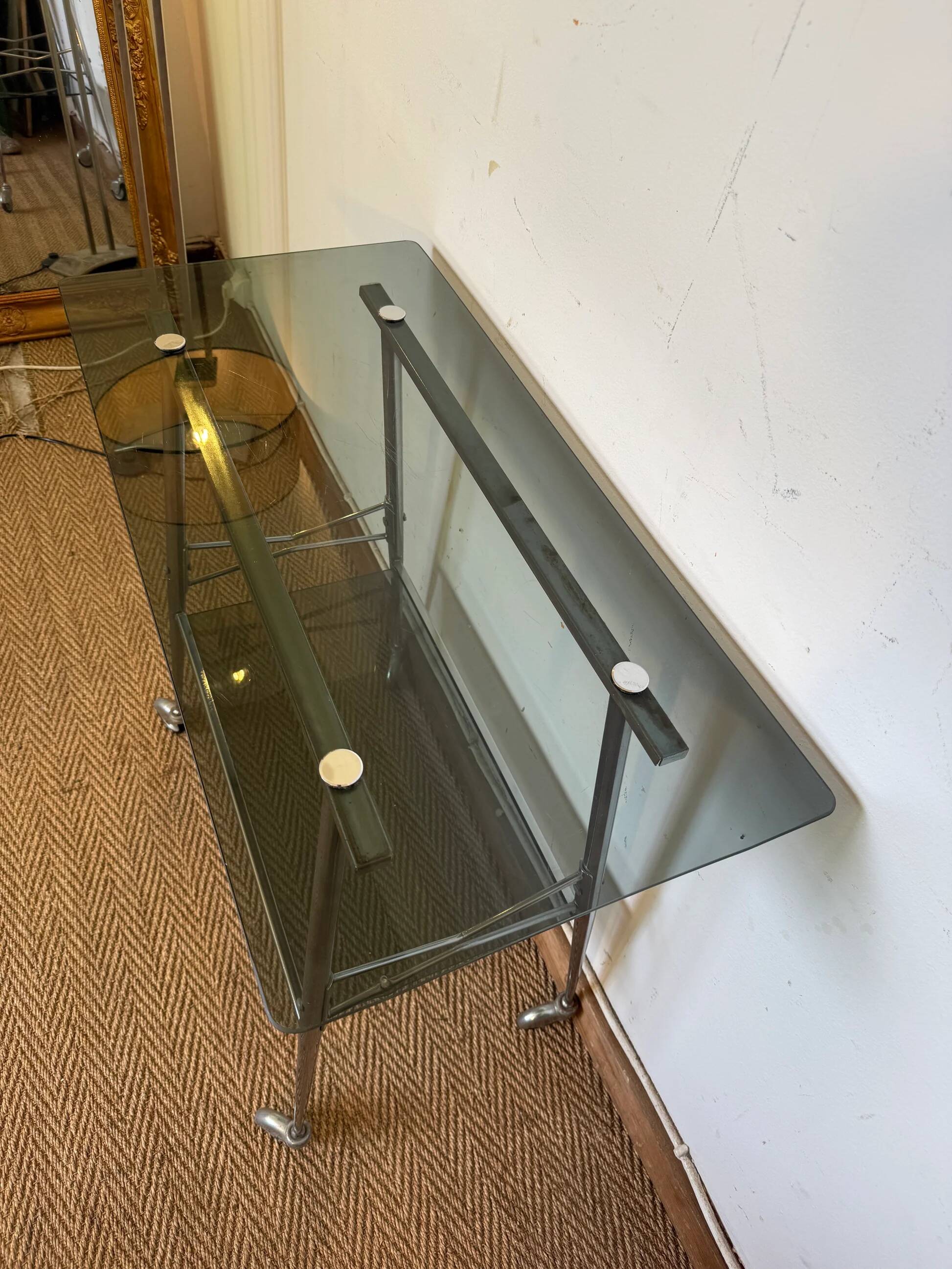 Dessert in chrome and vintage smoked glass.