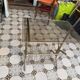 Vintage style side table with magazine holder, gold metal and glass top.