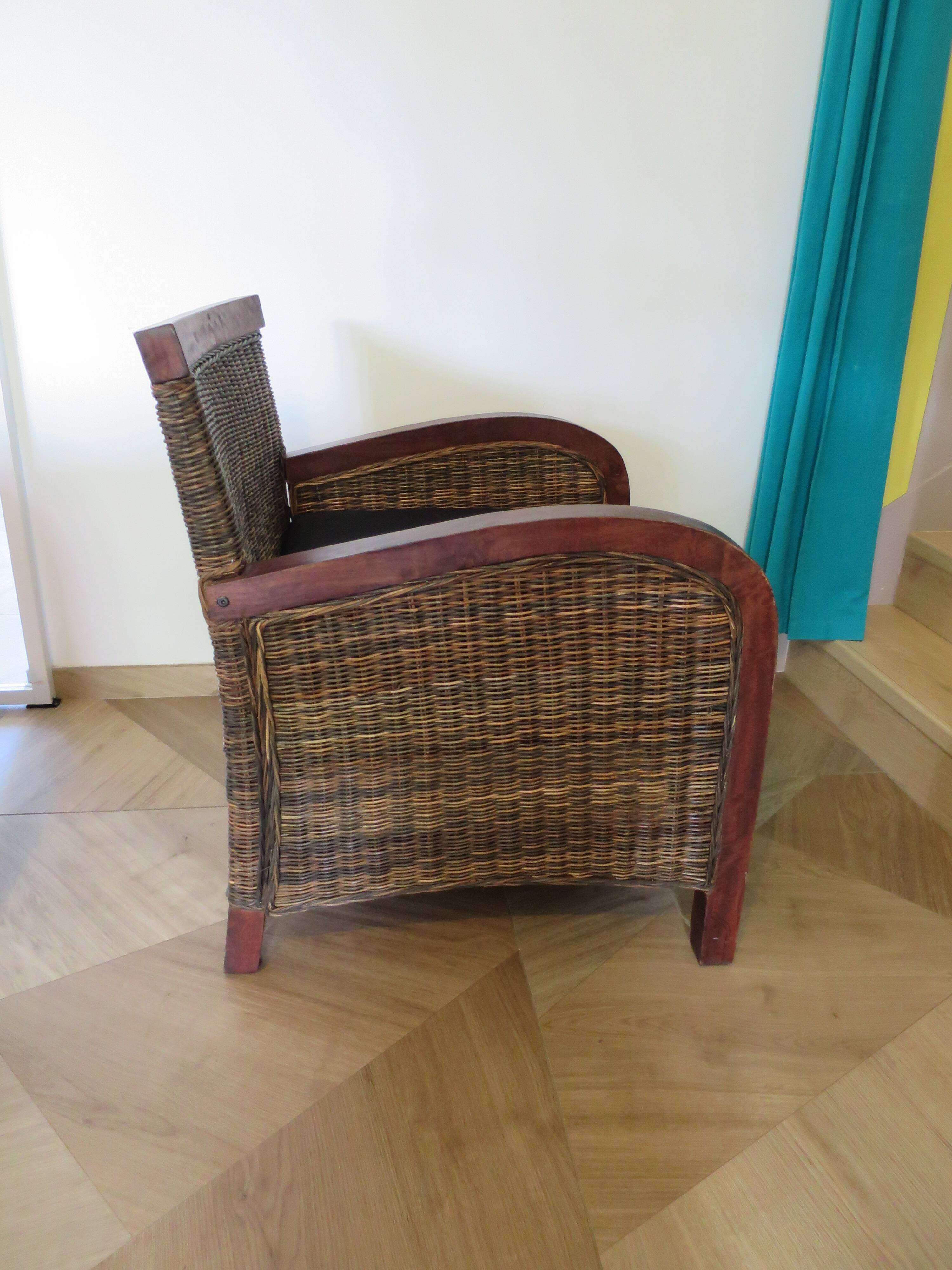 2 colonial-style armchairs in woven rattan and exotic wood