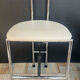 Vintage 70s chair in chrome metal and white faux leather.