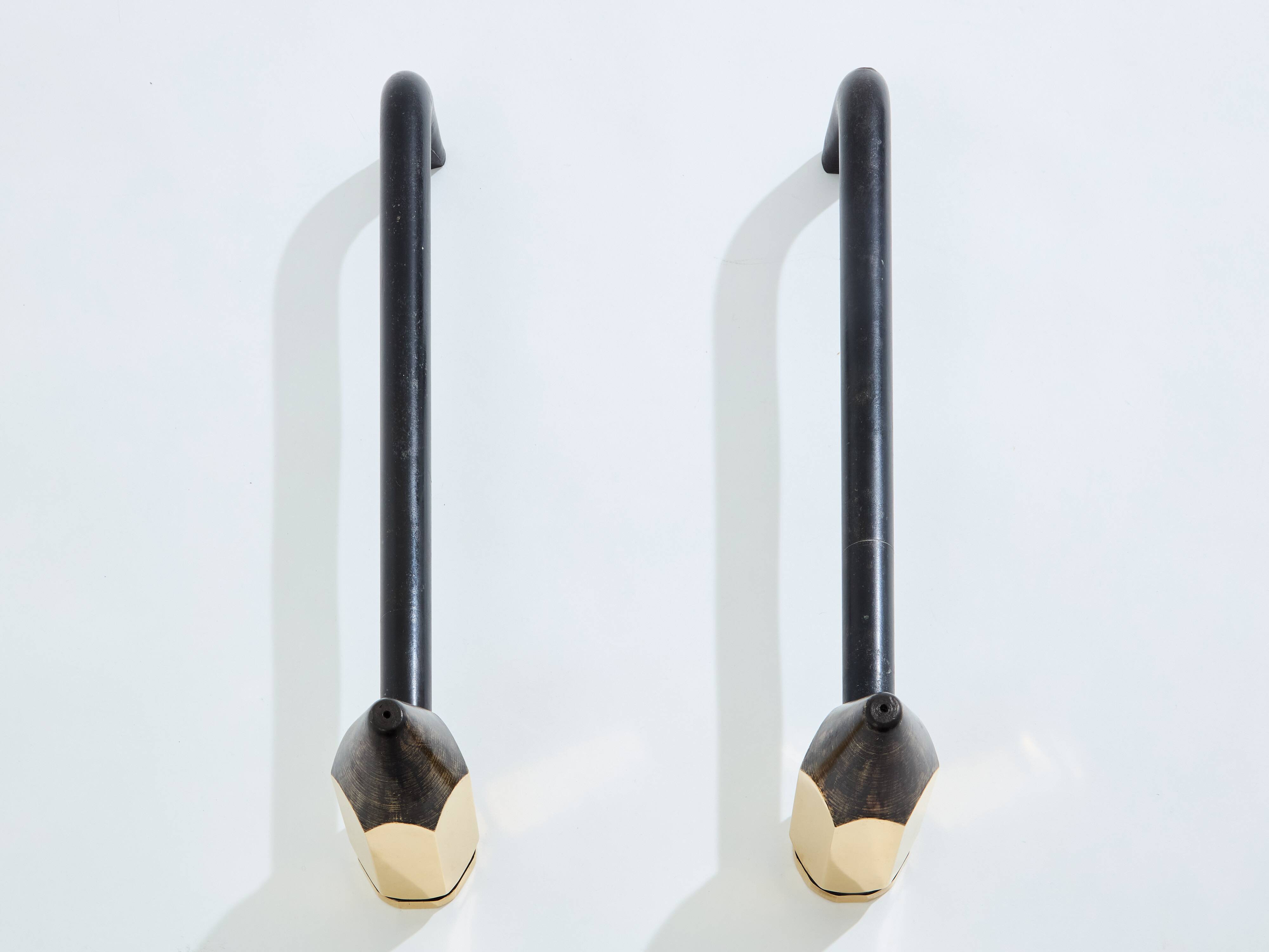 Pair of pencil andirons in brass and wrought iron circa 1960