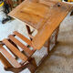 Old school desk with integrated adjustable seat.