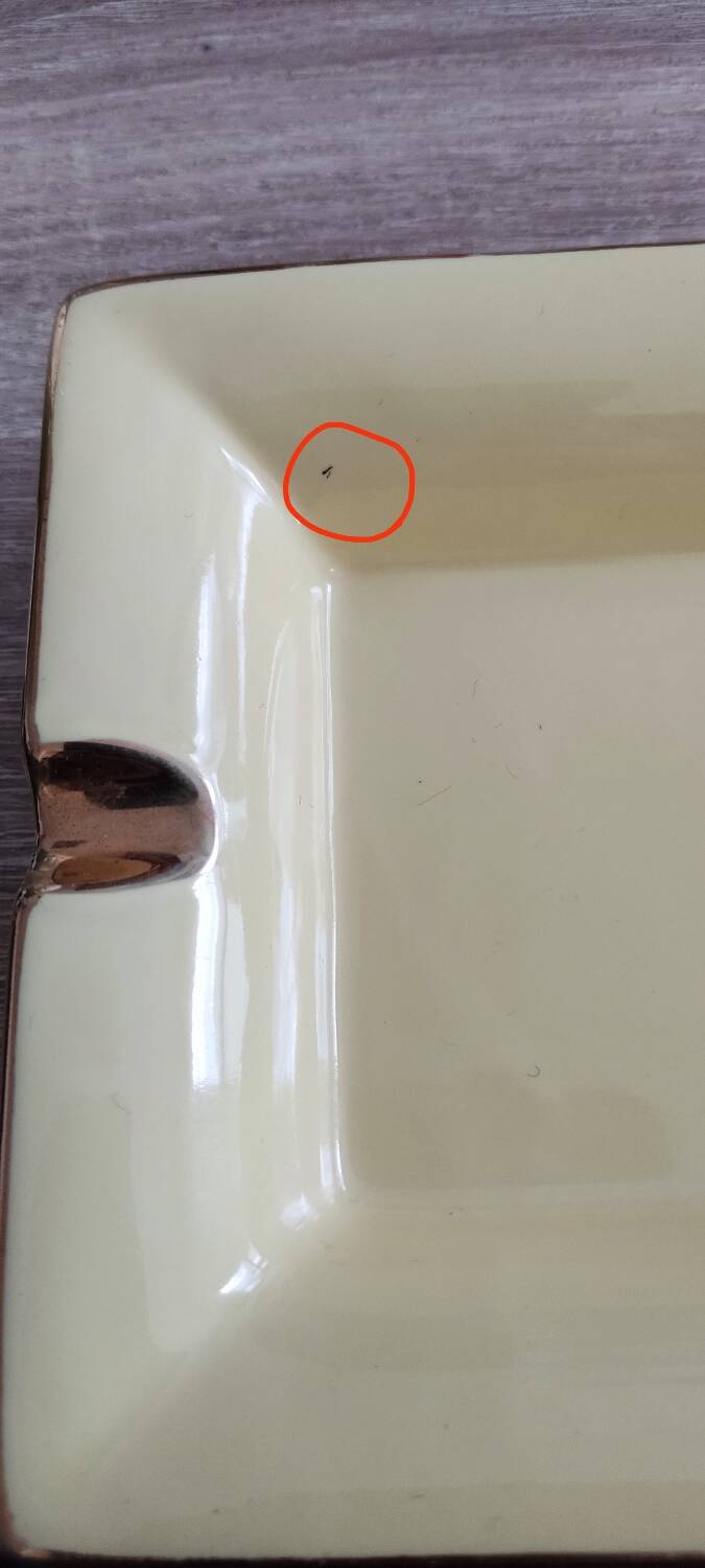 Vintage fine yellow and gold porcelain ashtray.