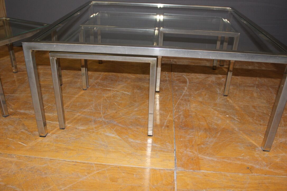 Coffee table and its steel and glass wiggles around 1970