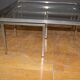 Coffee table and its steel and glass wiggles around 1970