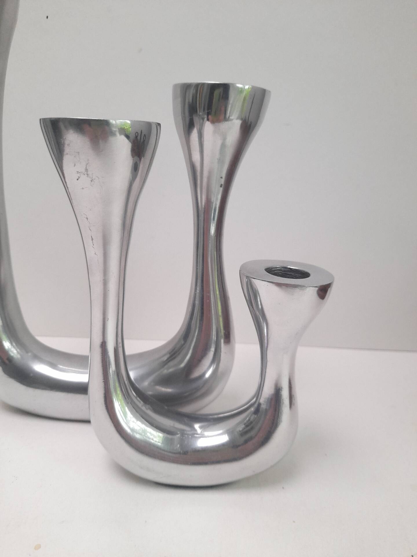 Pair of double candlesticks in aluminium cast iron