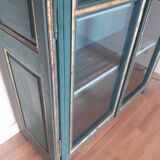 Glass cabinet in green patinated wood