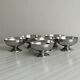 Set of 6 low footed bowls in mirror stainless steel.