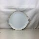 Plat rond ancien de couleur blanc et or blanc avec anses made in france Limoges