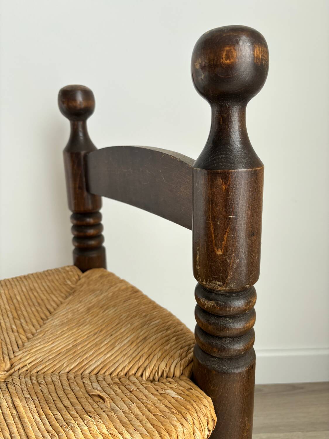 Vintage low chair in the style of Charles Dudouyt – Wooden fireside chair