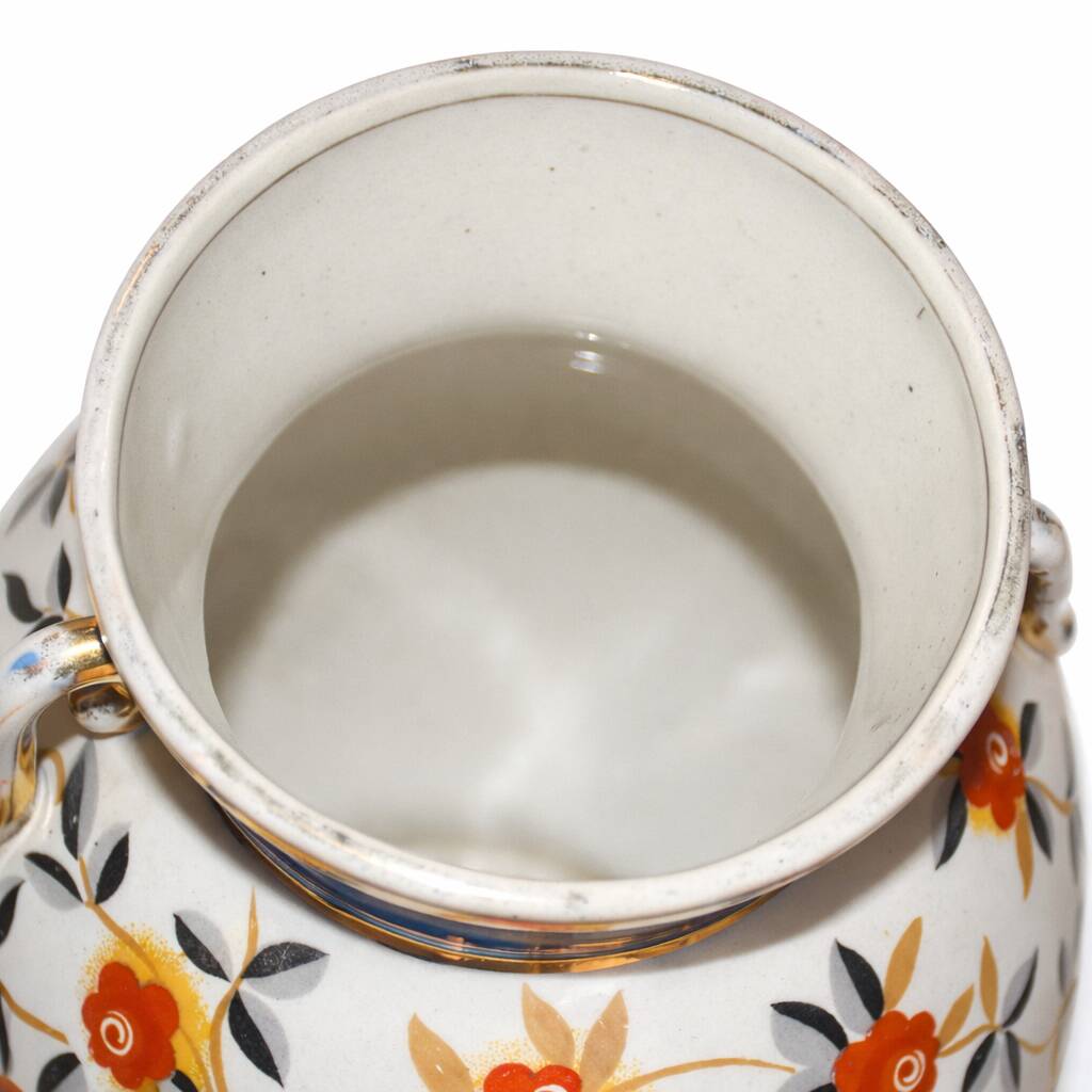 Art Deco round vase by Boch Frères Keramis, red flowers and blue bands.