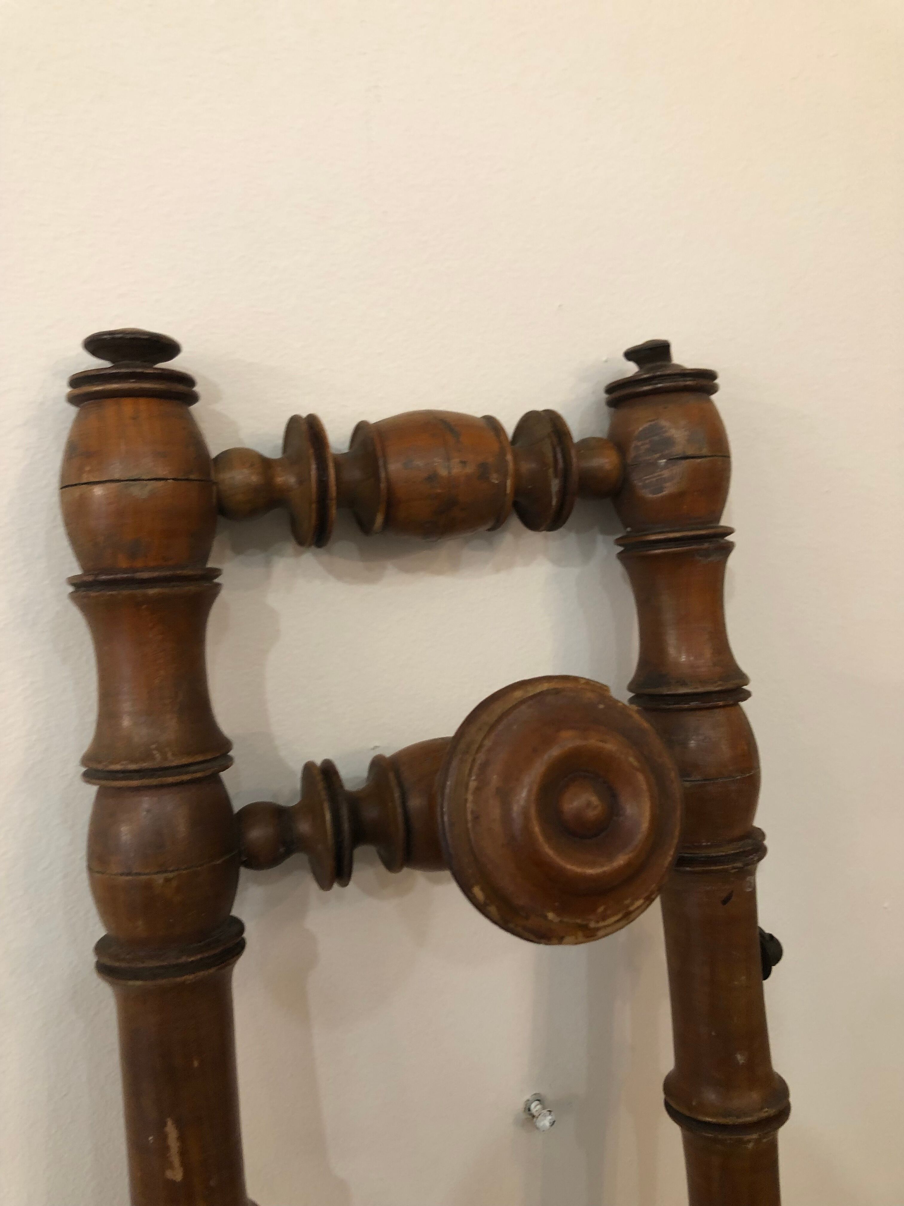 Wooden coat rack with swivel hooks