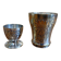 Silver-plated cup and egg cup set with floral decoration.