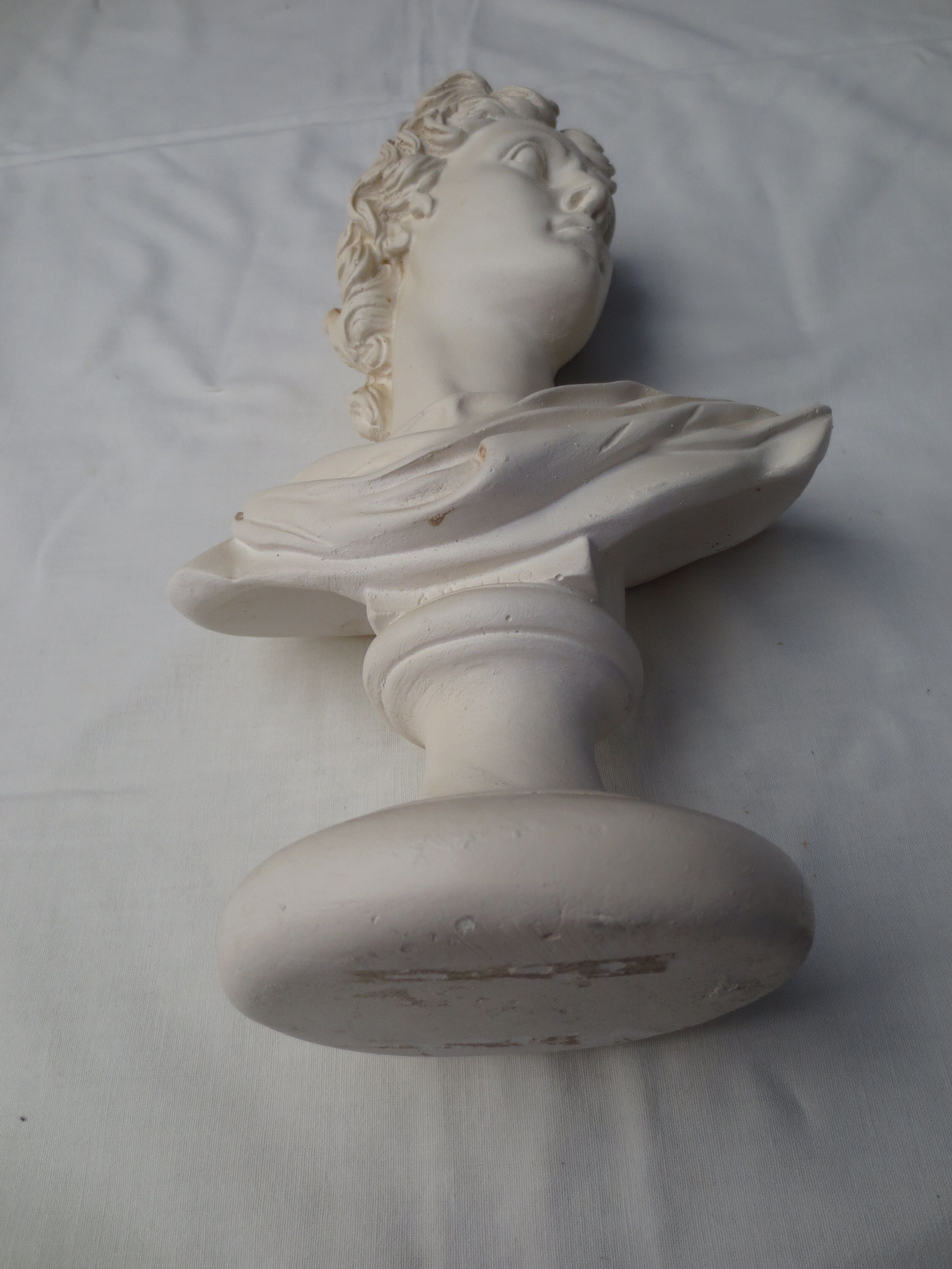 bust of antique subject on pedestal