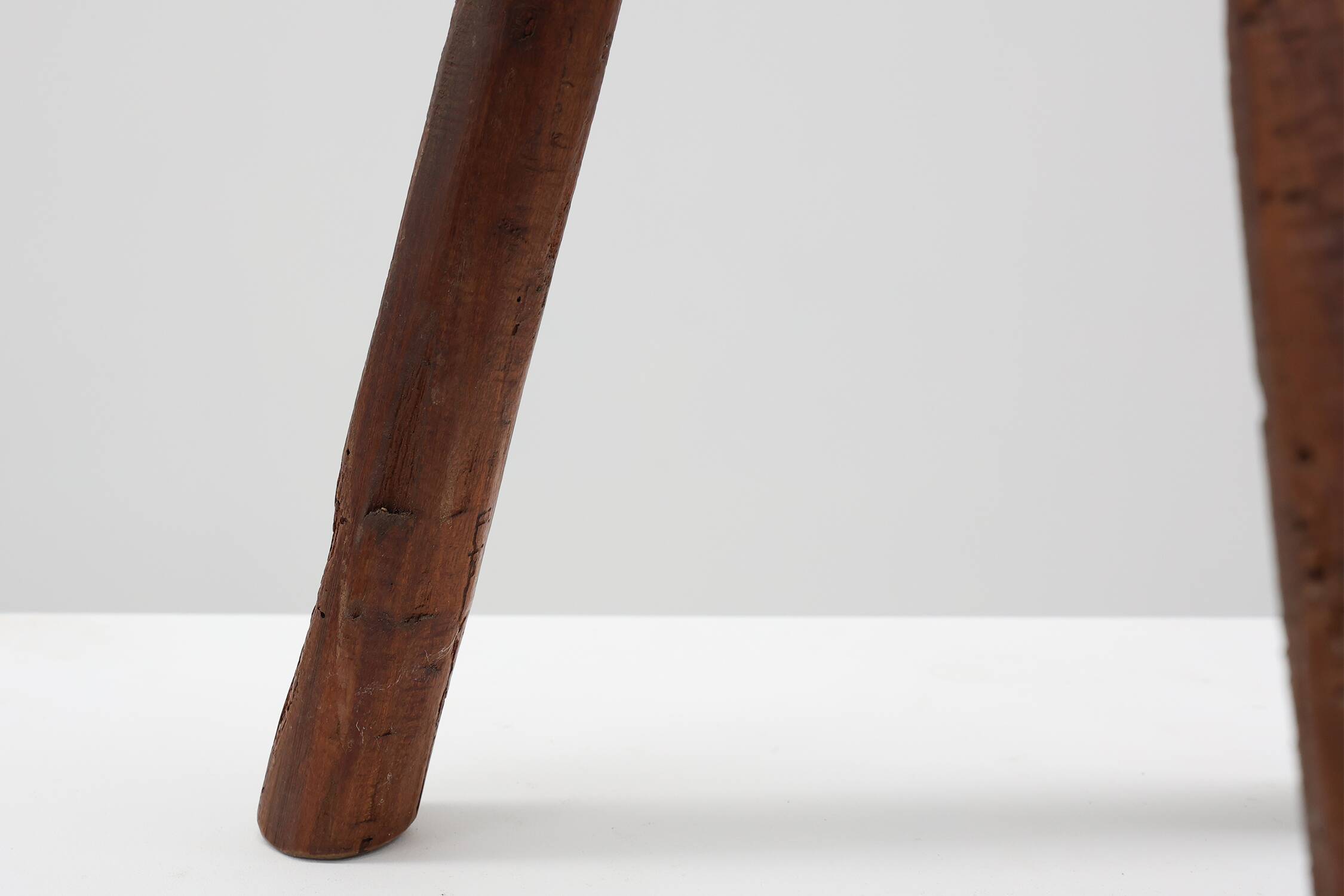 Brutalist French solid oak tripod stool with metal rim, 1850s