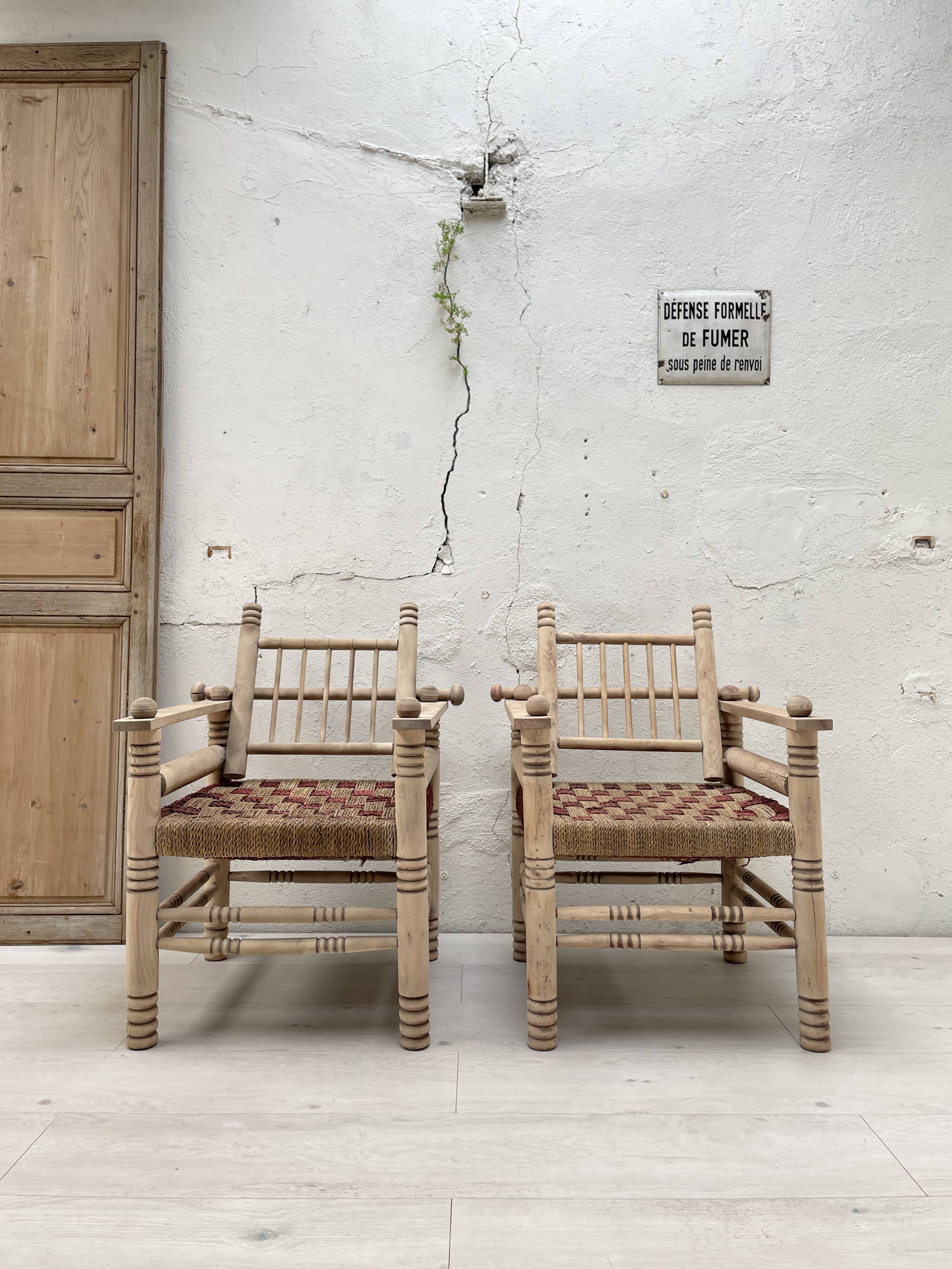 Pair of wooden armchairs and ropes
