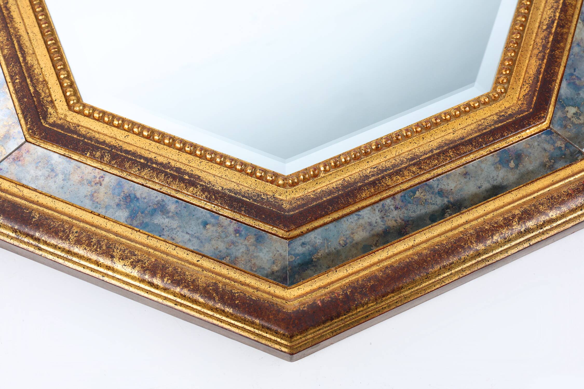 Gilded octagonal mirror by Deknudt Belgium decorated with smoked mirror gla
