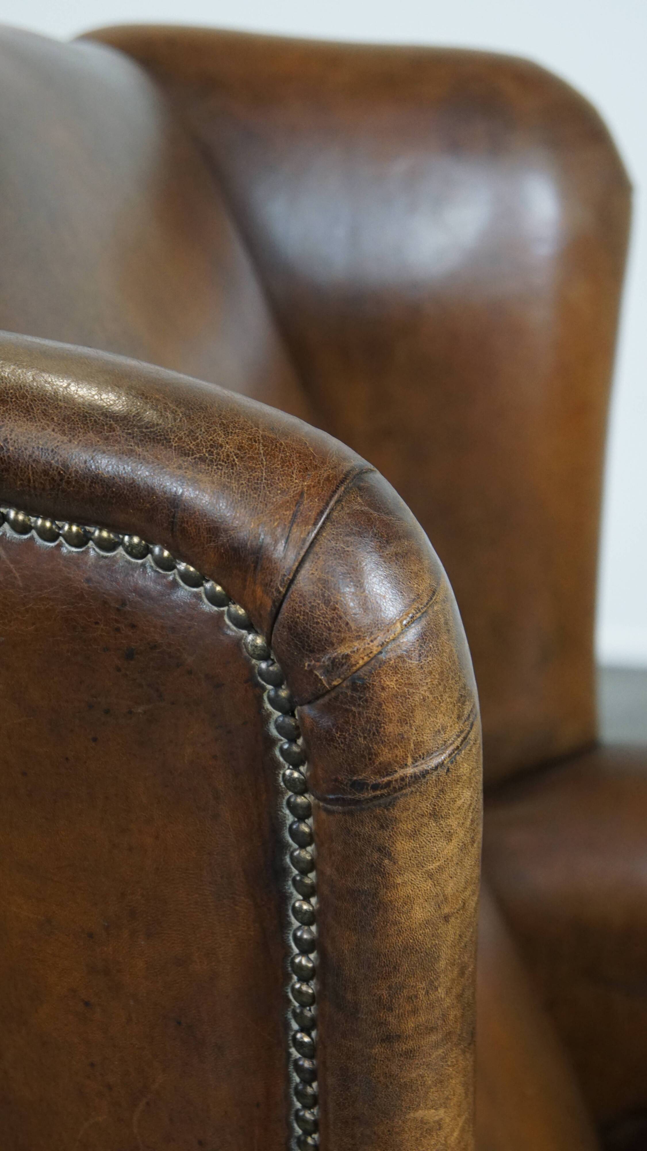 Sheep leather wingback chair with patina