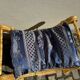 2 wooden footrests with blue cushions