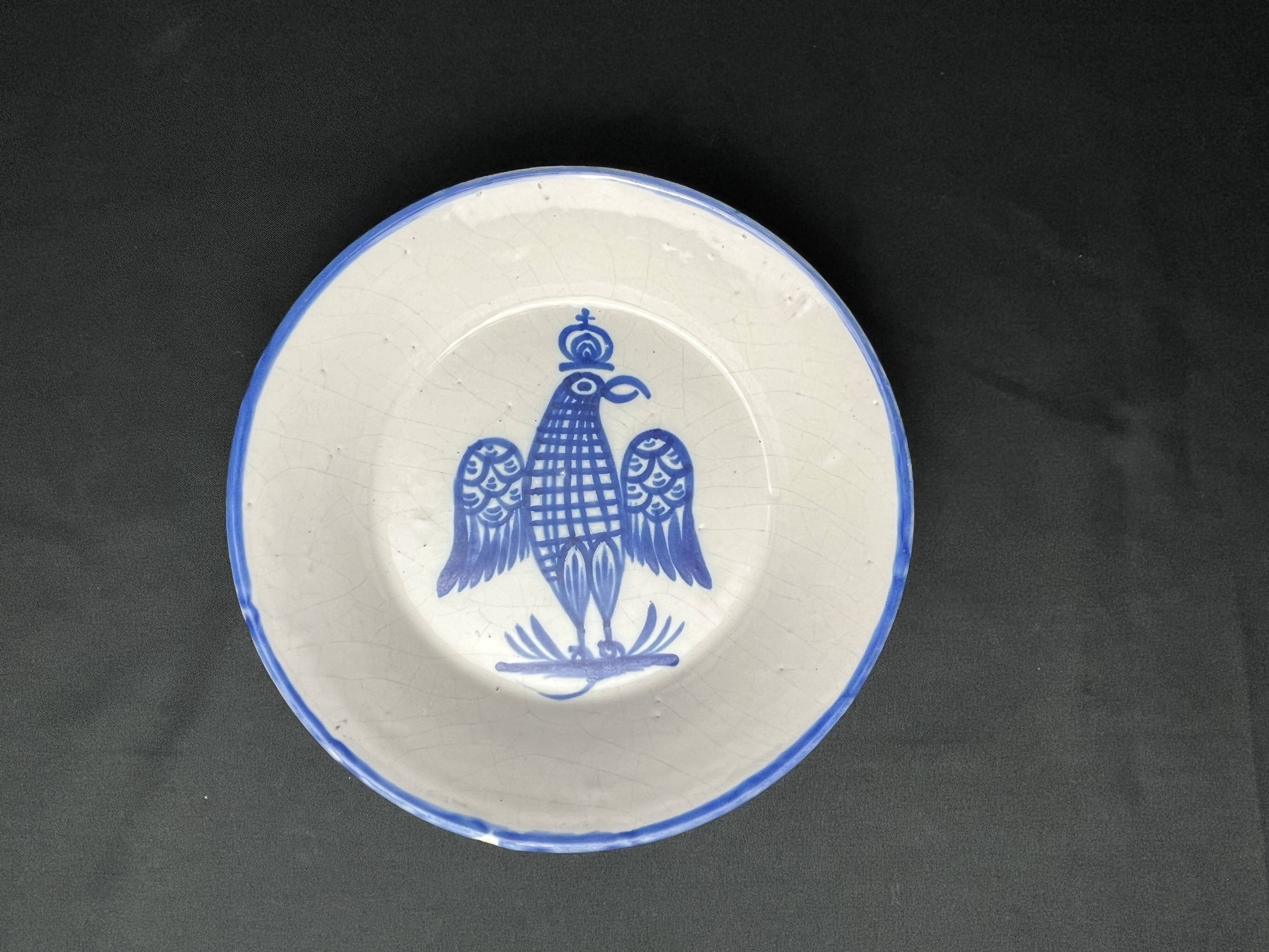 Besançon, dish decorated with a blue eagle, early 19th century