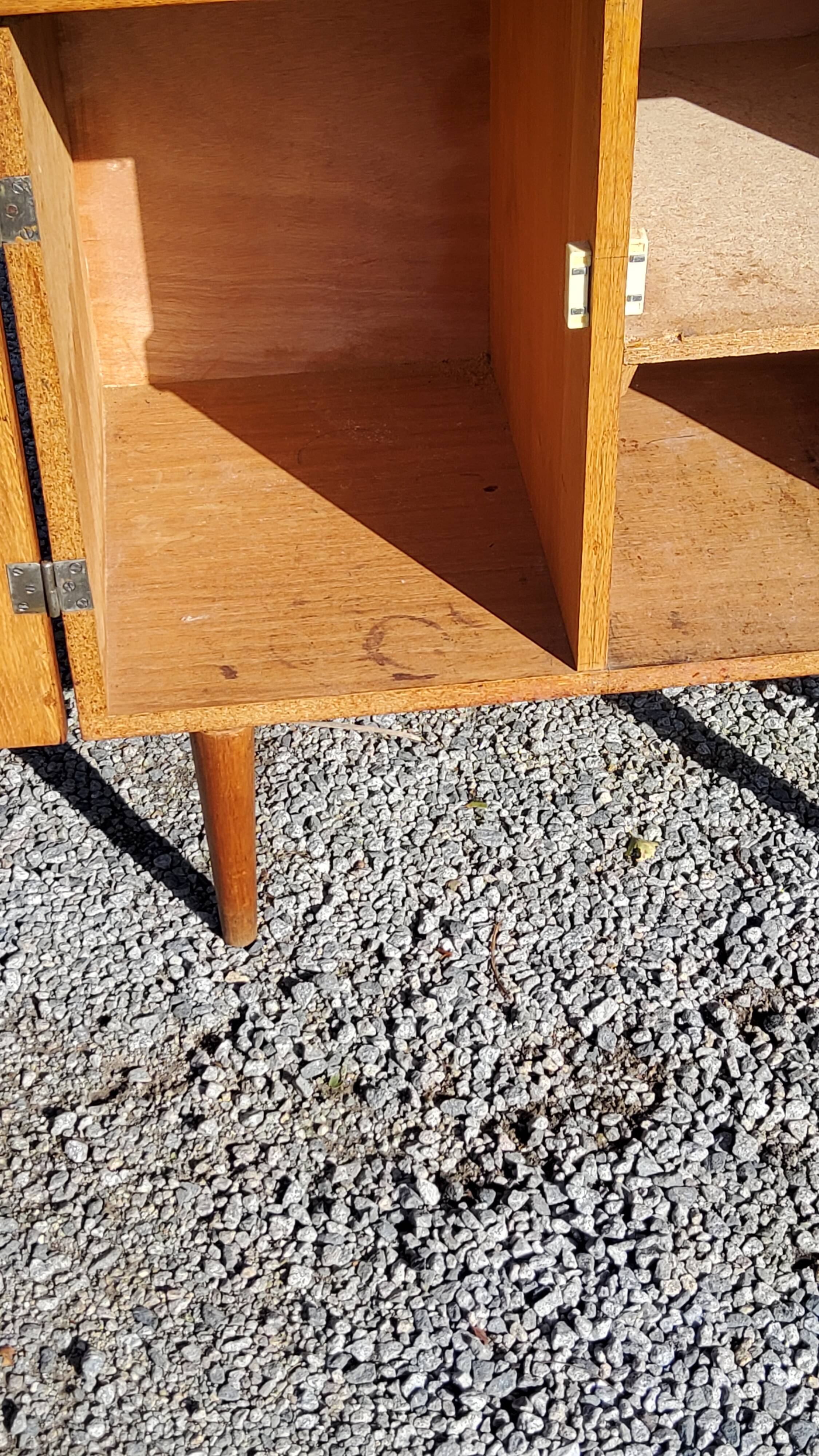 Vintage golden oak sideboard with conical legs from the 1950s