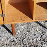 Vintage golden oak sideboard with conical legs from the 1950s