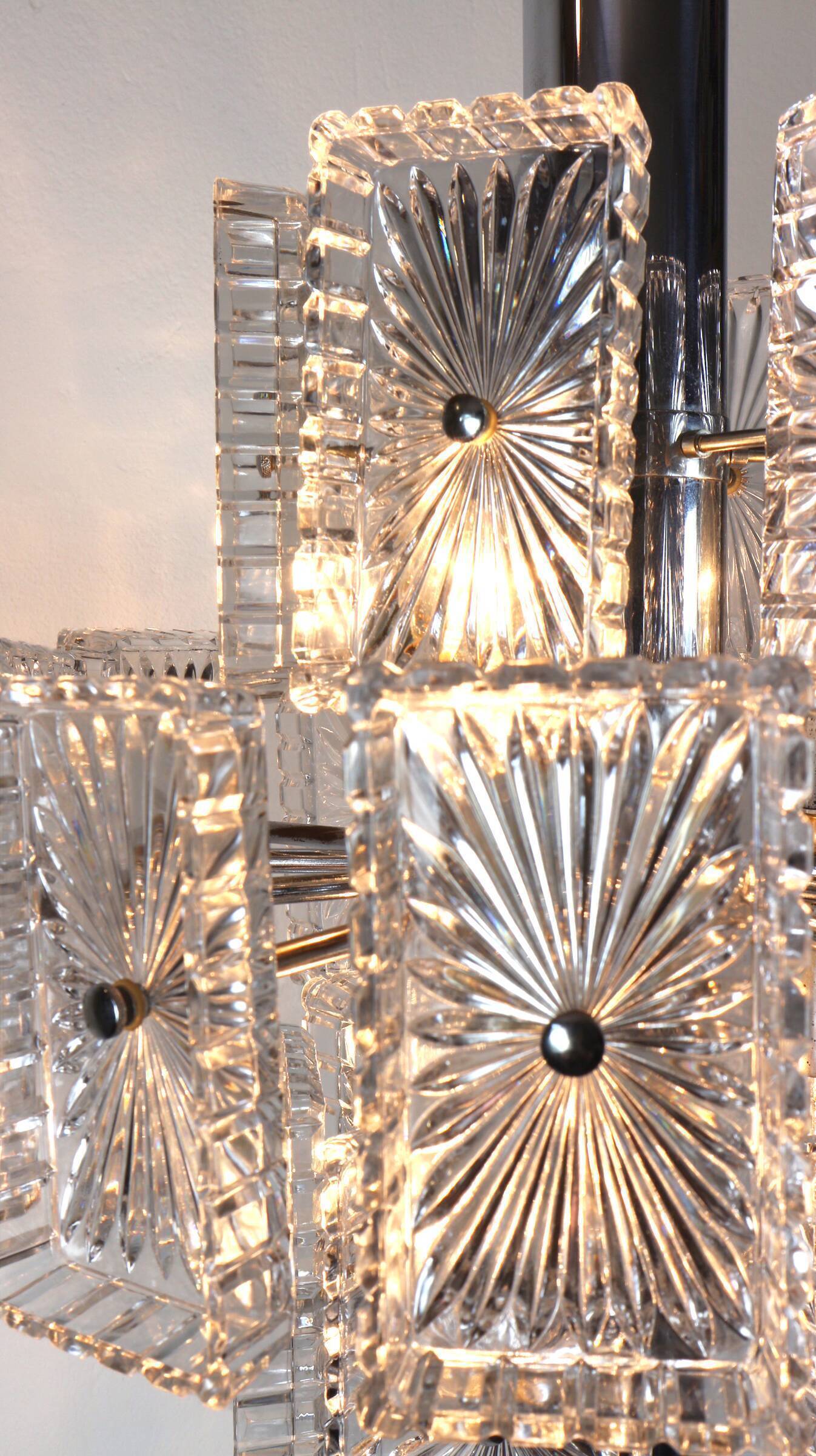 Vintage metal chandelier and carved glass