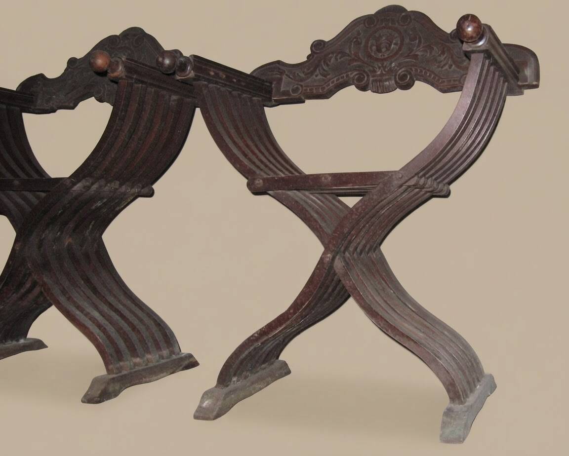Pair of antique Savonarole armchairs in Renaissance style.