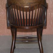 Antique English Edwardian captain's chair in oak by Ralph Johnson.