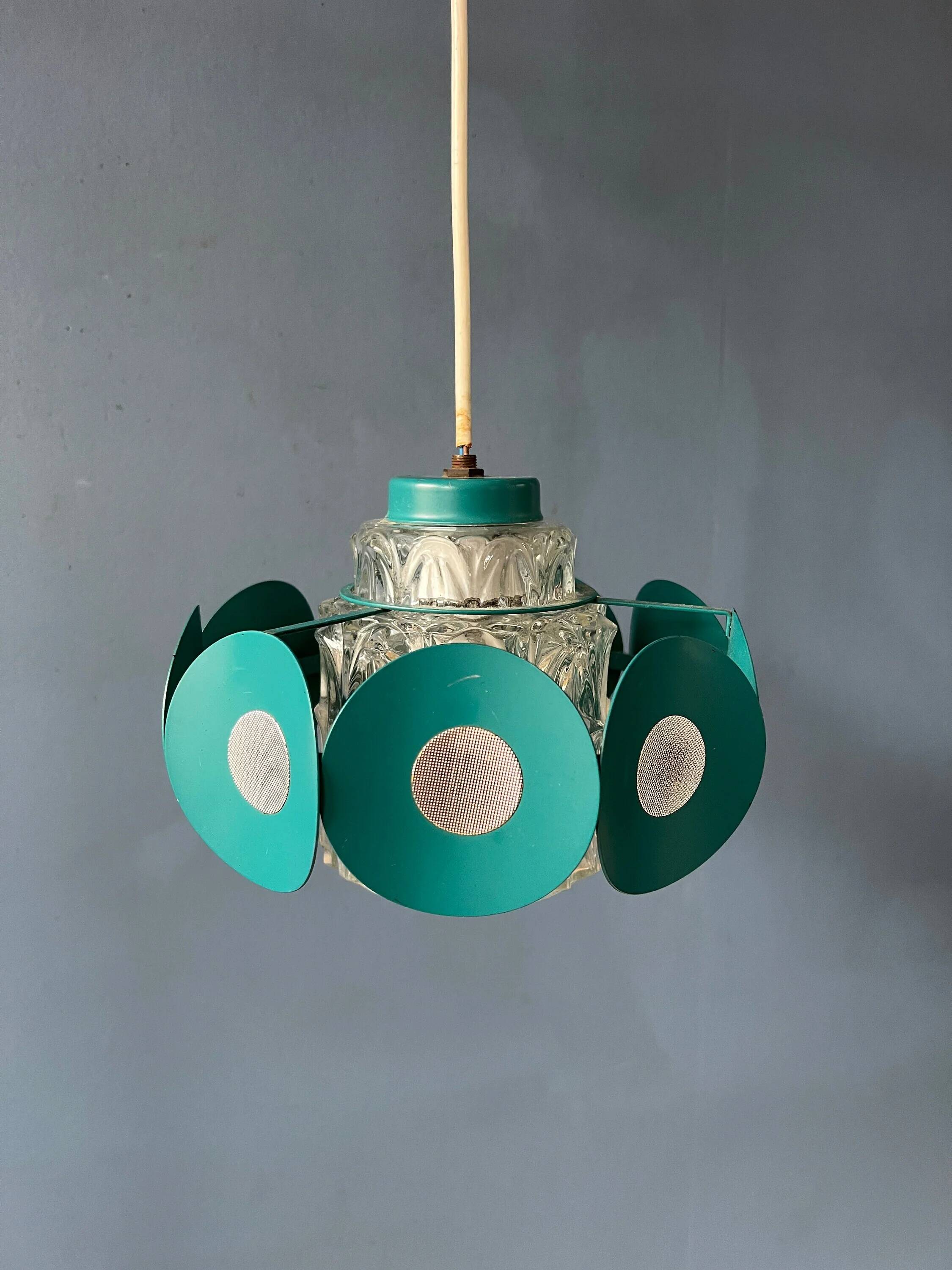 Suspension Space Age with glass shade and green/blue metal structure.