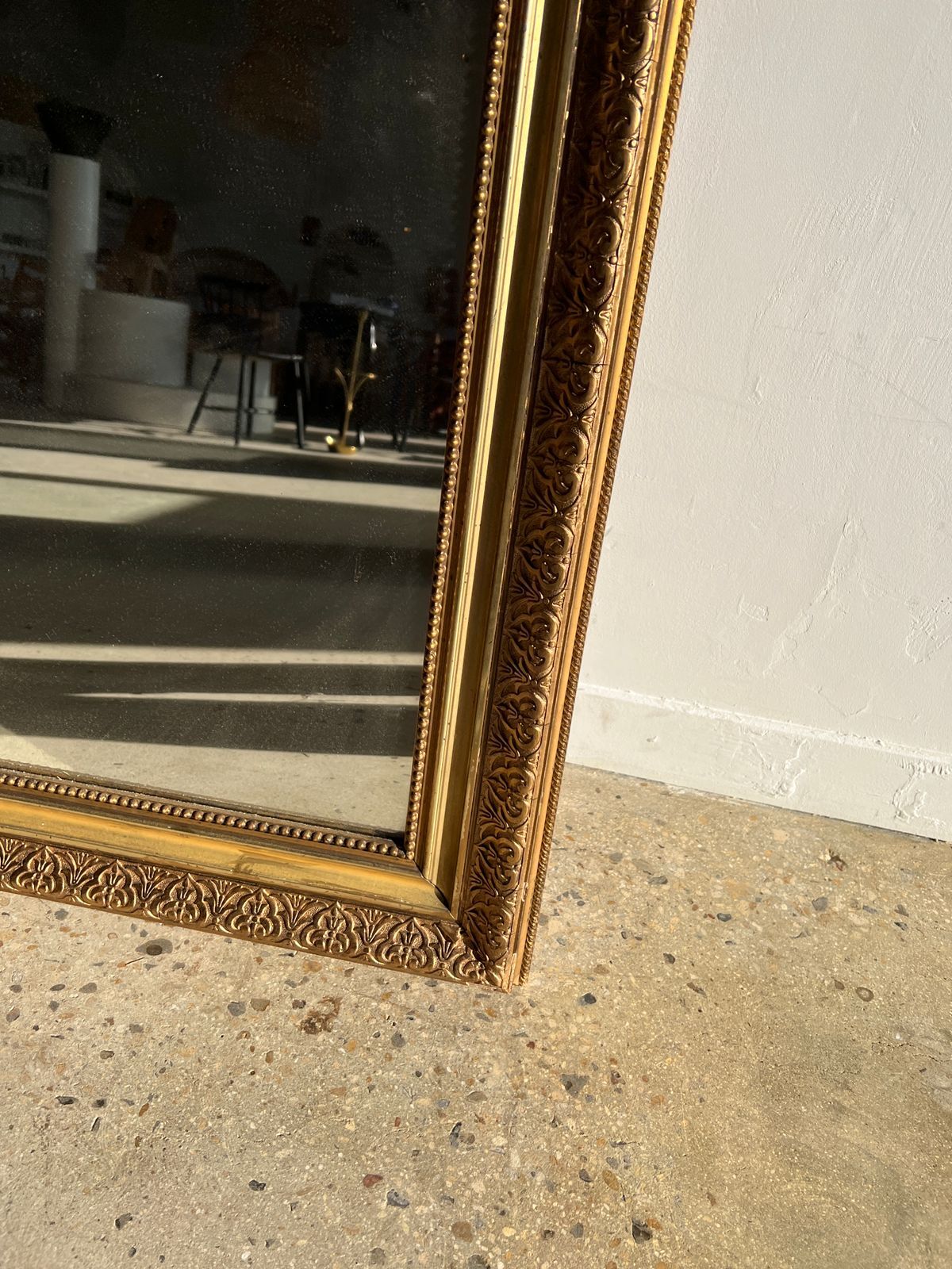 Gilded mirror with frieze h2m10 l:73cm