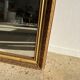 Gilded mirror with frieze h2m10 l:73cm