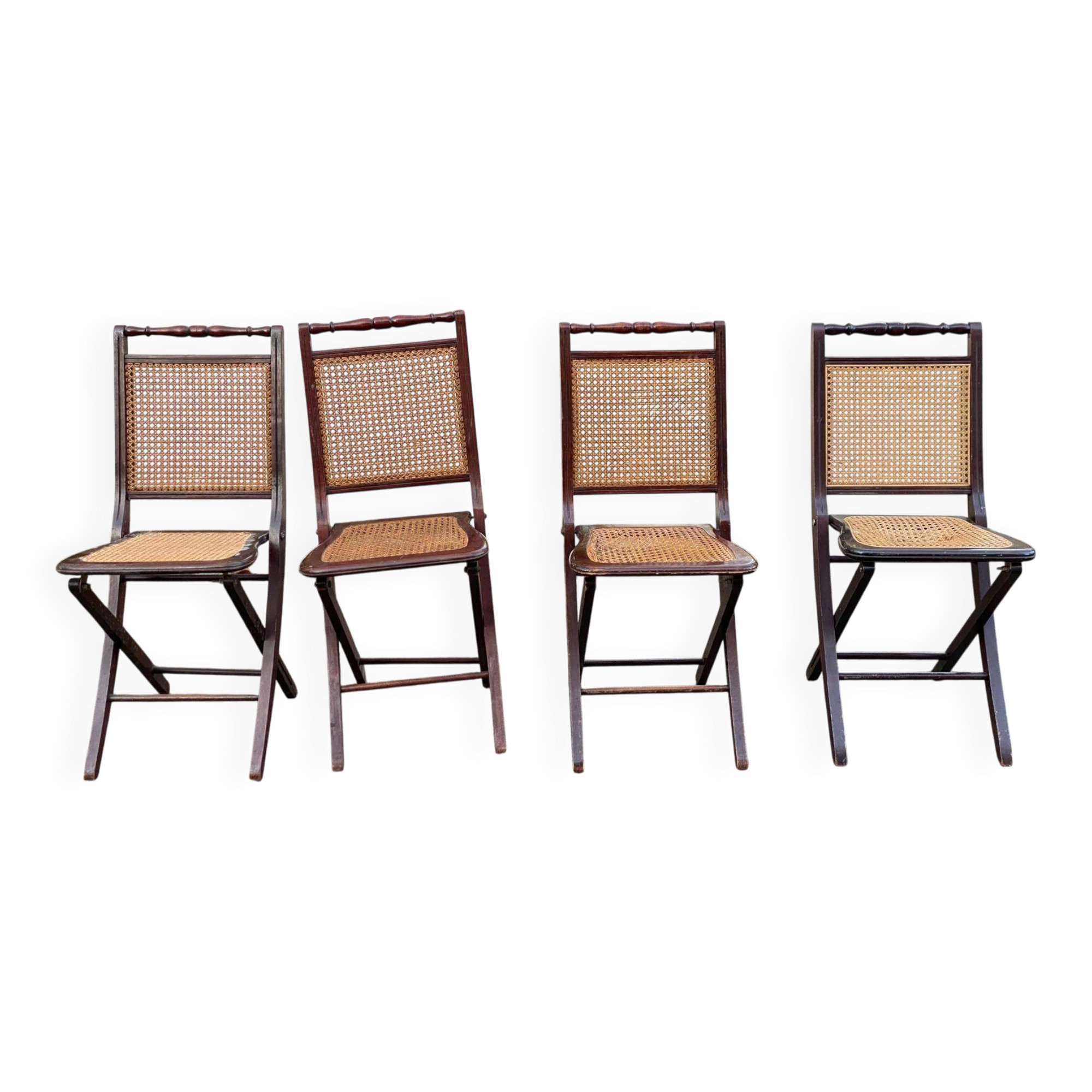 4 cane-seated solid wood folding chairs to be repaired.