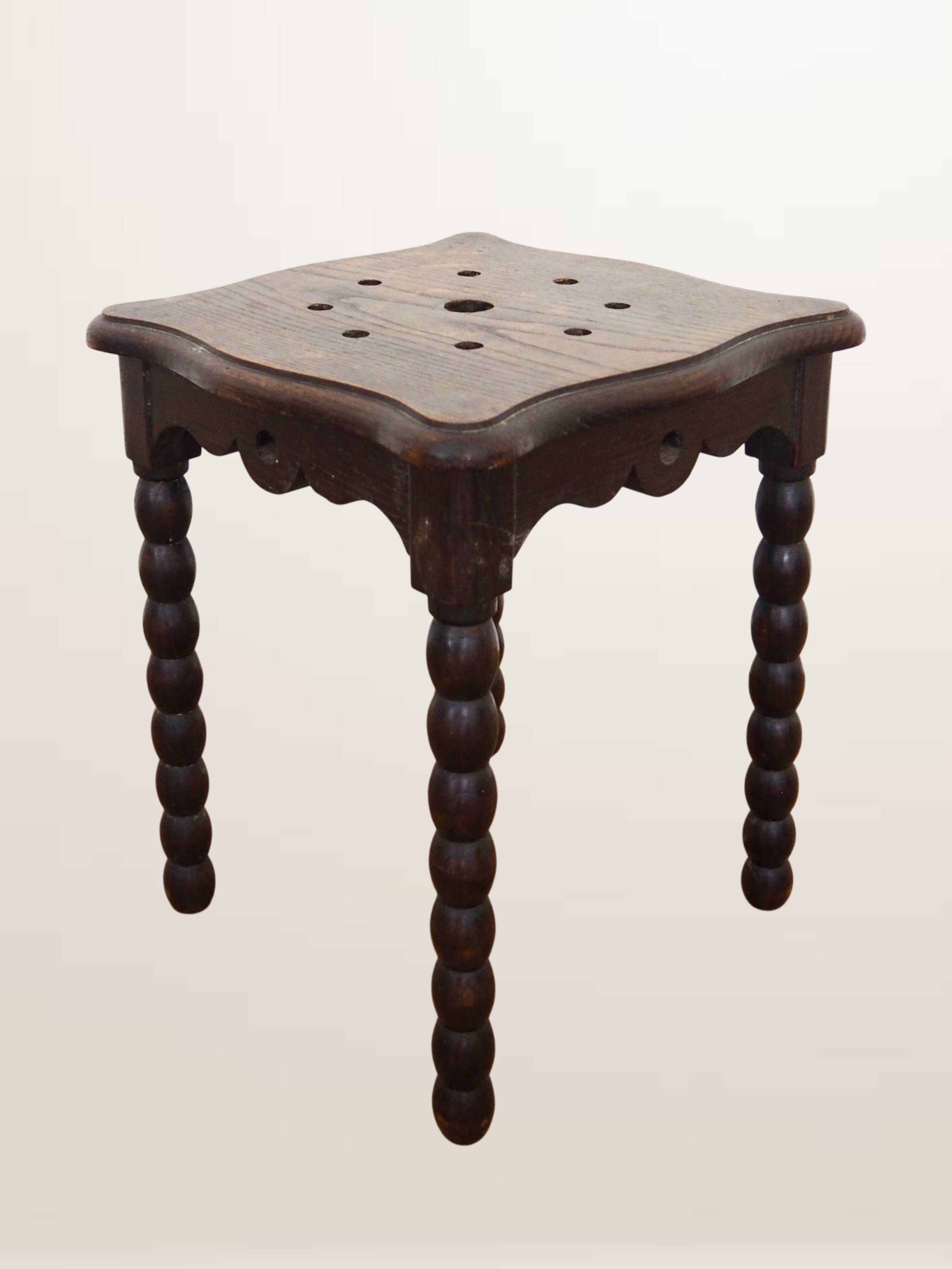 Oak stool with beaded spool legs