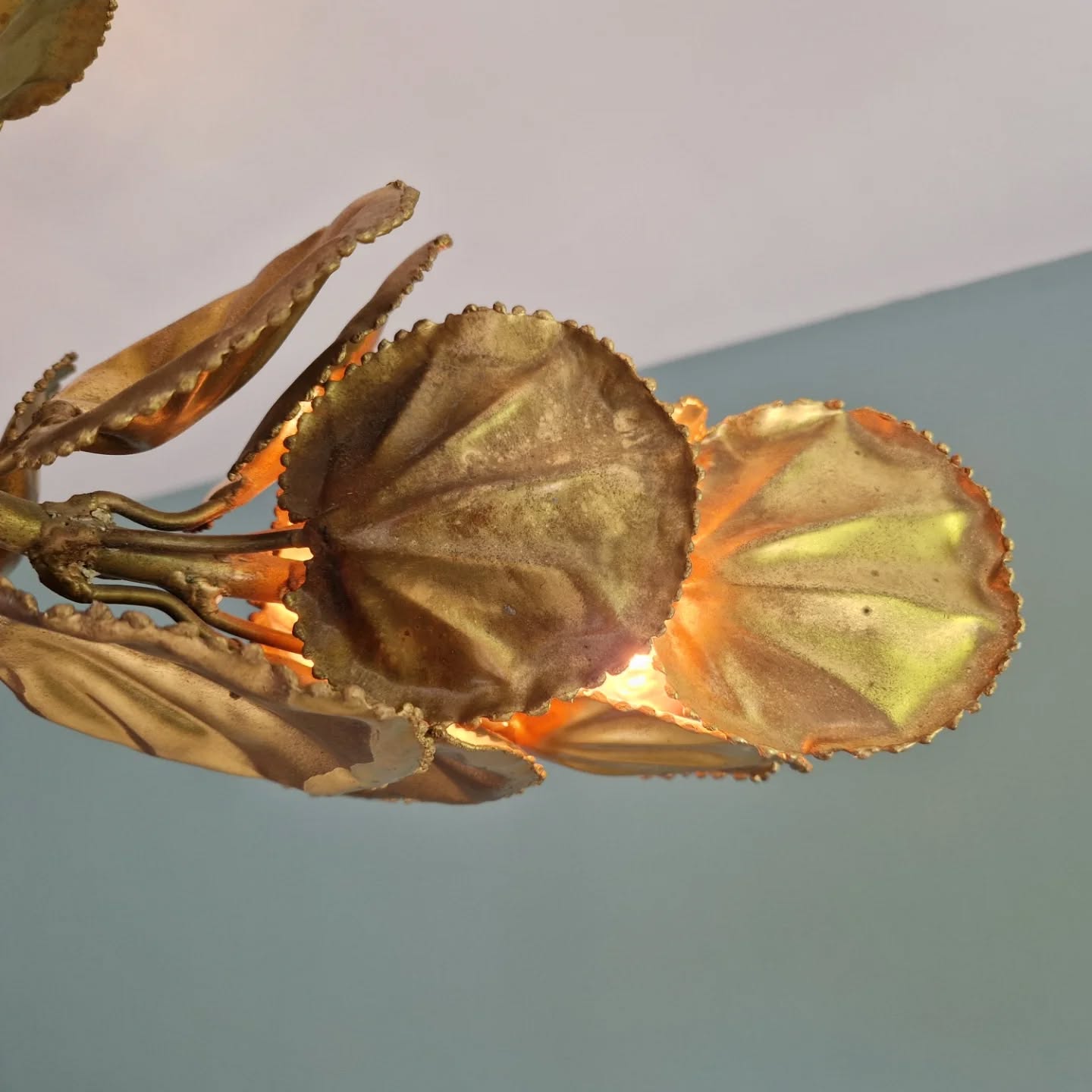 Large brutalist brass chandelier with floral decoration, 1970s.