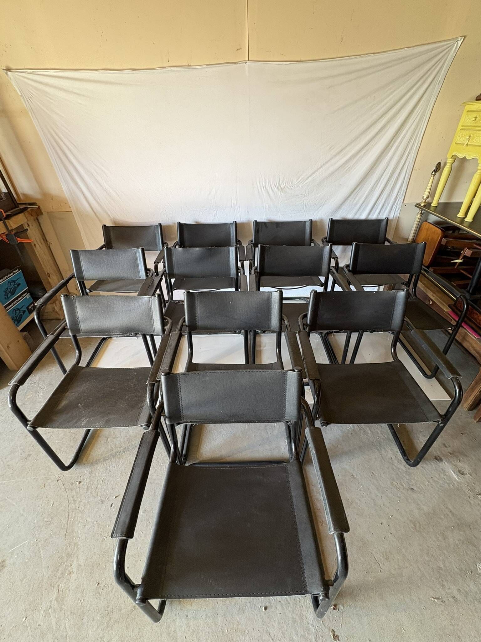 Set of 12 vintage black leather and tubular steel chairs – Italy, year
