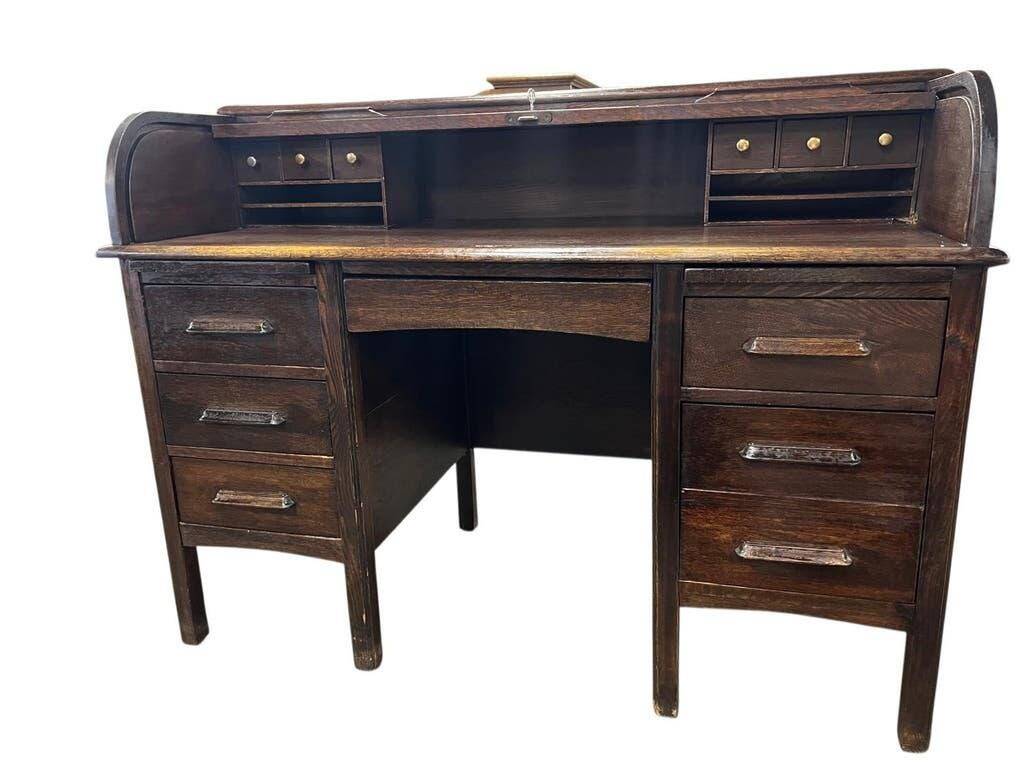 Vintage American wooden desk with a roll-top.