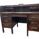 Vintage American wooden desk with a roll-top.