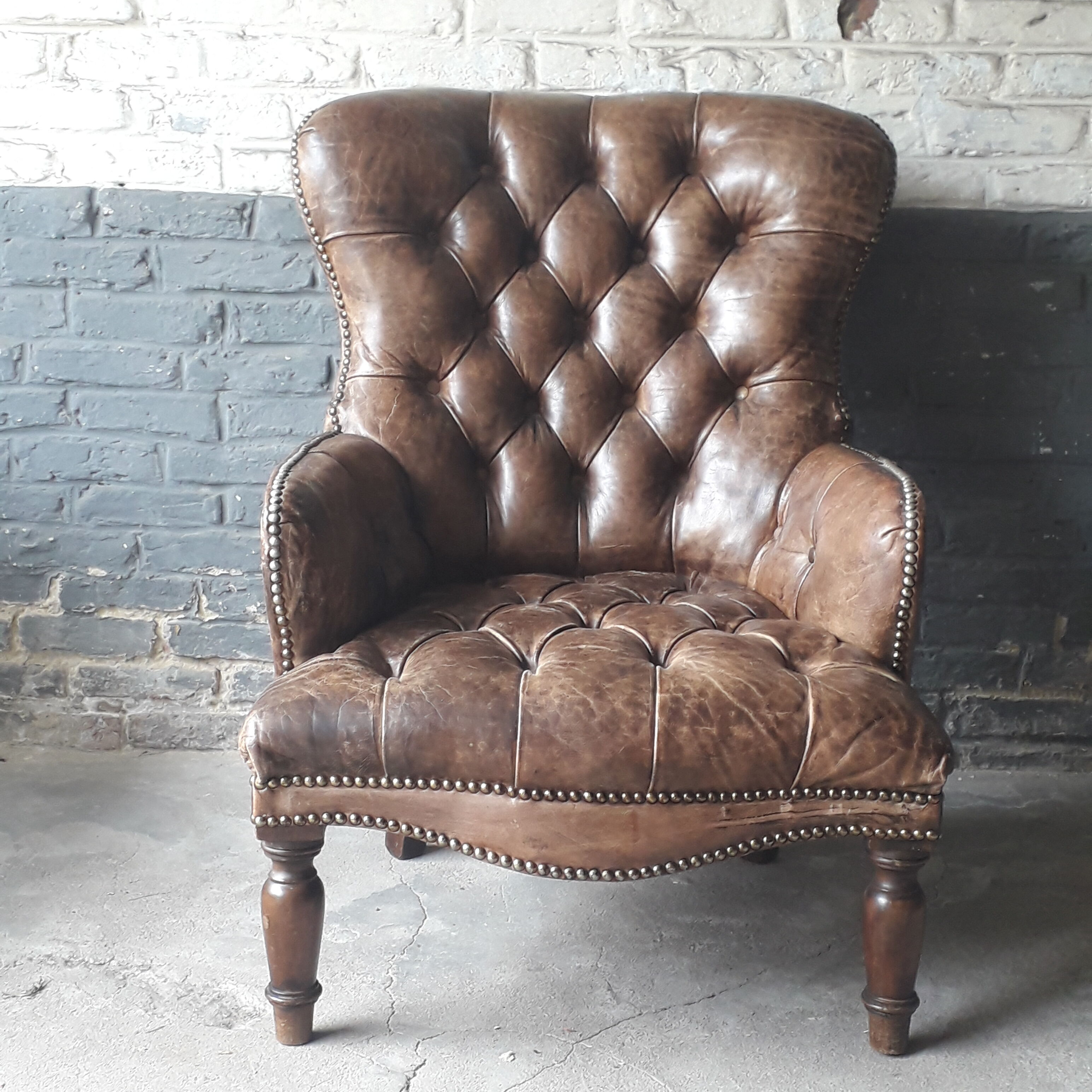 Antique Chesterfield armchair.