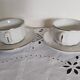 Apilco white and silver bistro cups