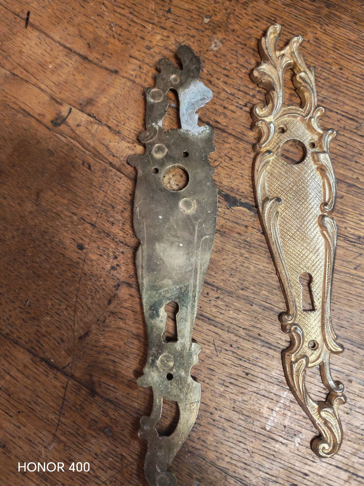 Pair of solid brass cleanliness plates in Louis XV rococo style.