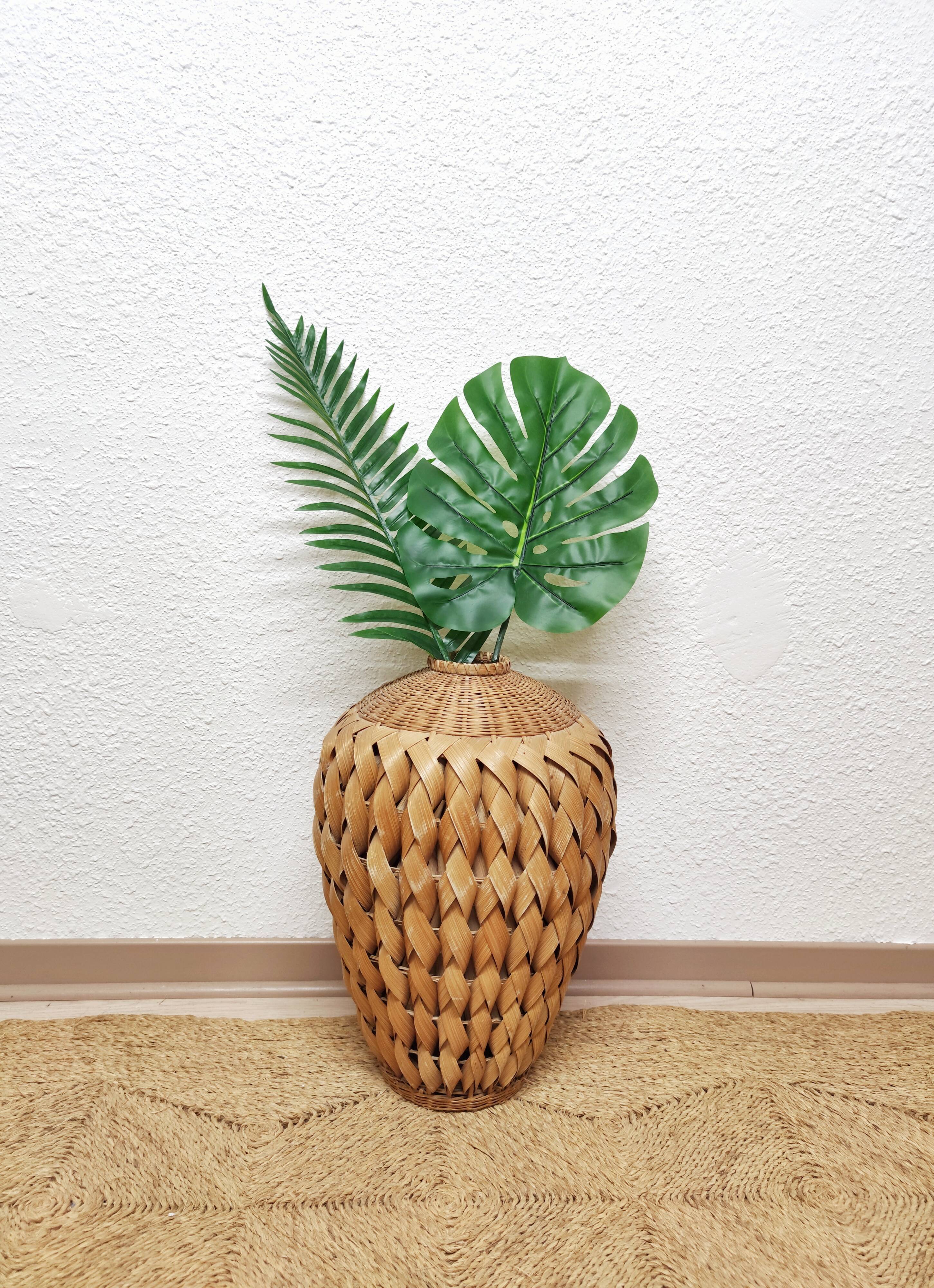 Vase in braided bamboo leaves