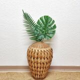 Vase in braided bamboo leaves