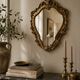 Golden rococo wall mirror
