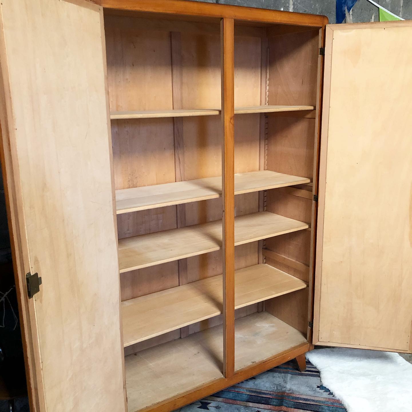 Vintage wooden cabinet with compass feet