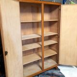 Vintage wooden cabinet with compass feet