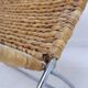 Chrome metal magazine rack with woven banana leaves