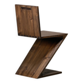 Gerrit Rietveld Zig Zag Chair is dark brown stained wood