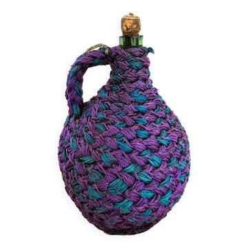 5-litre demijohn covered in coloured rope.