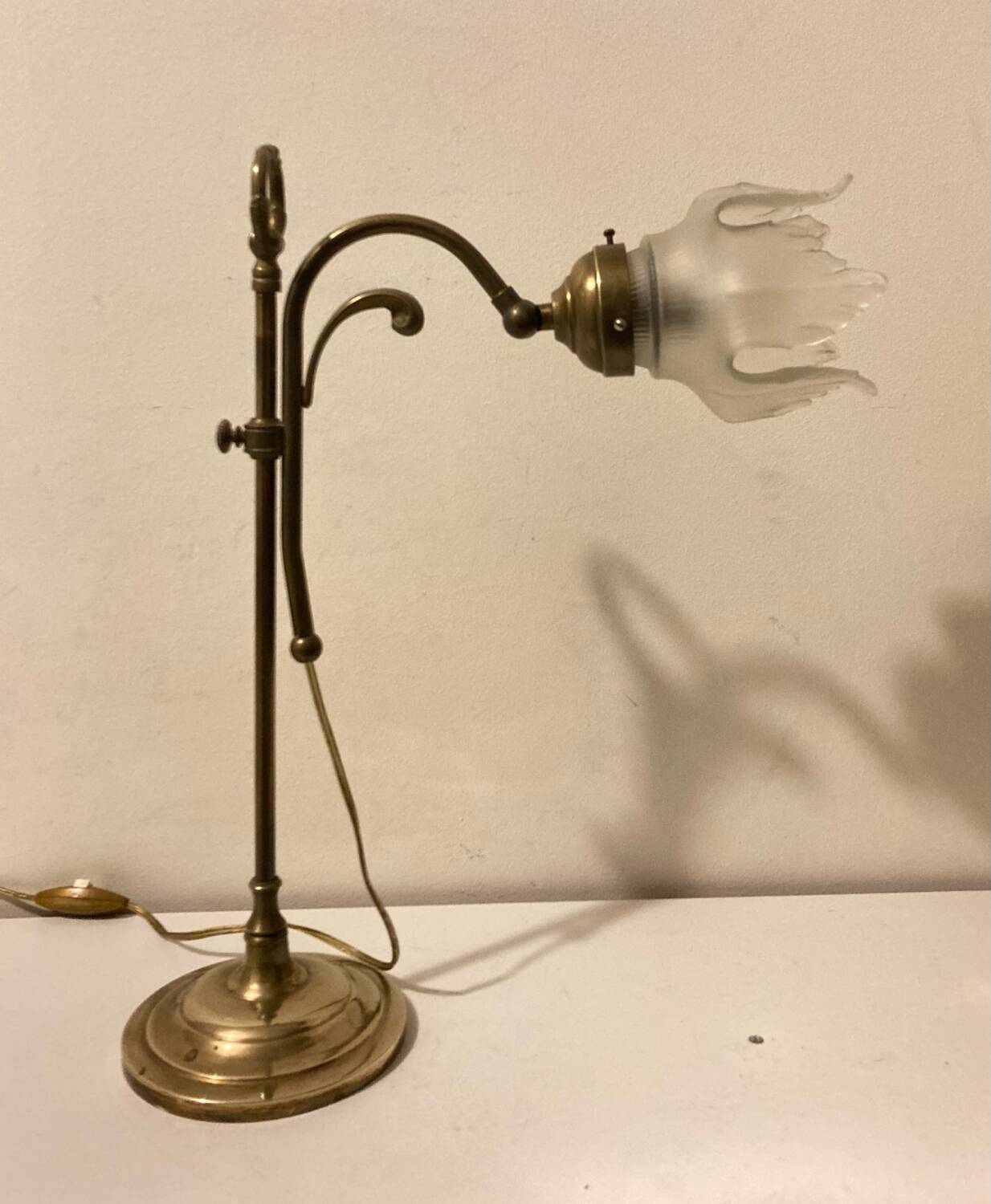 Brass table lamp with a glass shade